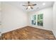 Bedroom featuring hardwood floors, ceiling fan, and natural light from window at 4006 Fall Oak Ter, Fort Mill, SC 29707