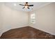 A bright bedroom with hardwood floors and a ceiling fan for comfortable living at 4006 Fall Oak Ter, Fort Mill, SC 29707