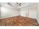 Spacious bedroom with tray ceiling, ceiling fan, and beautiful hardwood floors at 4006 Fall Oak Ter, Fort Mill, SC 29707