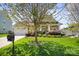 Traditional-style home featuring a well-manicured lawn, mature trees, and an inviting front porch at 4006 Fall Oak Ter, Fort Mill, SC 29707