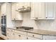 A well-equipped kitchen features white cabinets, stainless steel appliances, granite counters, and modern fixtures at 4006 Fall Oak Ter, Fort Mill, SC 29707