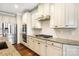 A well-equipped kitchen has white cabinets, stainless steel appliances, and granite countertops at 4006 Fall Oak Ter, Fort Mill, SC 29707
