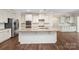 Bright, open kitchen with stainless steel appliances, granite countertops, and a large island at 4006 Fall Oak Ter, Fort Mill, SC 29707