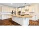 Spacious kitchen with an island features stainless appliances and granite countertops with ample cabinet space at 4006 Fall Oak Ter, Fort Mill, SC 29707