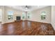 Spacious living room with hardwood floors, a stone fireplace, and ample natural light at 4006 Fall Oak Ter, Fort Mill, SC 29707