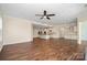 Open floor plan seamlessly connects living area and kitchen with island and cabinetry at 4006 Fall Oak Ter, Fort Mill, SC 29707
