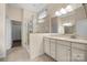 Bright main bathroom with double vanity, walk-in shower, and neutral finishes at 4006 Fall Oak Ter, Fort Mill, SC 29707