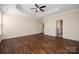 Serene main bedroom with hardwood floors, tray ceiling, neutral paint, and ceiling fan at 4006 Fall Oak Ter, Fort Mill, SC 29707