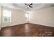 Large main bedroom with hardwood floors, tray ceiling, neutral paint, ceiling fan, and natural light at 4006 Fall Oak Ter, Fort Mill, SC 29707