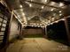 Inviting covered patio featuring string lights and a concrete slab, perfect for outdoor gatherings at 4006 Fall Oak Ter, Fort Mill, SC 29707