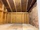 Unfinished basement showing unfinished plywood subfloor, structural beams, and utilities at 406 Williamson St, Fort Mill, SC 29715