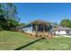 Charming blue home with a inviting front porch and beautifully landscaped front yard, perfect for curb appeal at 406 Williamson St, Fort Mill, SC 29715