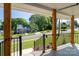 Front porch view showcasing wooden pillars, black railings, and neighborhood scenery, perfect for relaxing outdoors at 406 Williamson St, Fort Mill, SC 29715