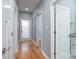Hallway with hardwood floors, grey paint, and white doors and trim at 406 Williamson St, Fort Mill, SC 29715