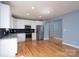Modern kitchen with stainless steel appliances, granite countertops, and sleek white cabinetry, perfect for culinary enthusiasts at 406 Williamson St, Fort Mill, SC 29715