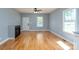 Spacious living room with hardwood floors, fireplace, and natural light streaming through the windows, perfect for entertaining at 406 Williamson St, Fort Mill, SC 29715