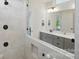 Modern bathroom with dual shower heads, light-colored tiling, and vanity at 4120 Spring Cove Way, Belmont, NC 28012