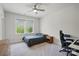 Comfortable bedroom featuring natural light, ceiling fan, desk, and neutral carpet at 4120 Spring Cove Way, Belmont, NC 28012