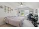 Bright bedroom with a ceiling fan, carpet, and large windows, creating a cozy and inviting personal space at 4120 Spring Cove Way, Belmont, NC 28012