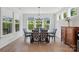 Bright dining room features large windows and a stylish chandelier at 4120 Spring Cove Way, Belmont, NC 28012