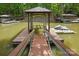 Private boat dock provides easy access to the lake and features a covered area, ideal for boating and water sports enthusiasts at 4120 Spring Cove Way, Belmont, NC 28012