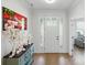 Bright foyer with wood flooring and beautiful accent pieces that lead into the home at 4120 Spring Cove Way, Belmont, NC 28012