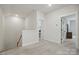 Upstairs hallway with neutral carpeting and trimmed doorway entrances at 4120 Spring Cove Way, Belmont, NC 28012