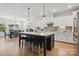 Spacious kitchen features a large island with seating and an adjacent dining area at 4120 Spring Cove Way, Belmont, NC 28012