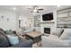Spacious living room with a fireplace, built-ins, and stylish furniture at 4120 Spring Cove Way, Belmont, NC 28012