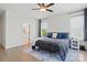 Comfortable main bedroom with a ceiling fan and great lighting from multiple windows at 4120 Spring Cove Way, Belmont, NC 28012