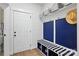 Cozy mudroom with a storage bench, coat hooks, and storage baskets above at 4120 Spring Cove Way, Belmont, NC 28012