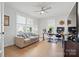 Brightly lit home office with hardwood floors, a ceiling fan, and three windows at 4120 Spring Cove Way, Belmont, NC 28012
