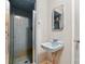 Small bathroom features a blue tiled shower and sink. Ready for renovation at 422 Sherrill Farm Rd, Lincolnton, NC 28092
