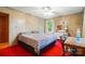 Inviting bedroom with wood paneling, natural light, and a ceiling fan at 422 Sherrill Farm Rd, Lincolnton, NC 28092