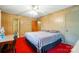 Bright bedroom offers wood paneling, natural light, and convenient bathroom access at 422 Sherrill Farm Rd, Lincolnton, NC 28092