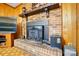 Close-up of brick fireplace with a decorative mantle and vintage hardware at 422 Sherrill Farm Rd, Lincolnton, NC 28092