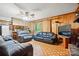 Cozy living room with wood paneling, comfortable seating, and a view of the backyard at 422 Sherrill Farm Rd, Lincolnton, NC 28092