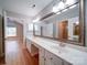 Bright bathroom featuring double sinks, large mirror, and modern lighting at 4754 Polo Gate Blvd, Charlotte, NC 28216