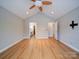 Spacious bedroom with vaulted ceiling, ceiling fan, and wood-look flooring at 4754 Polo Gate Blvd, Charlotte, NC 28216