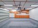 Well lit garage with built-in wood cabinets and epoxy flooring at 4754 Polo Gate Blvd, Charlotte, NC 28216