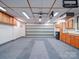 Spacious garage with built in cabinets and epoxy flooring at 4754 Polo Gate Blvd, Charlotte, NC 28216