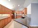 Modern kitchen with stainless steel appliances, granite countertops, and stylish cabinetry with under cabinet lighting at 4754 Polo Gate Blvd, Charlotte, NC 28216