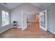 Spacious living room with French doors, an open design, and wood floors, offers a seamless flow at 4754 Polo Gate Blvd, Charlotte, NC 28216