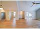 Large open-concept living room featuring neutral walls and wood-look floors at 4754 Polo Gate Blvd, Charlotte, NC 28216