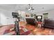 Open bonus room with a vaulted ceiling, exercise bike, and a comfortable seating area, perfect for recreation at 5225 Mcchesney Dr, Charlotte, NC 28269