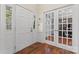 Bright foyer showcasing hardwood floors, a glass-paneled door, and natural light at 5225 Mcchesney Dr, Charlotte, NC 28269