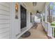 Cozy front porch featuring a ceiling fan, seating, and a welcoming entrance at 5225 Mcchesney Dr, Charlotte, NC 28269