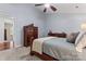 Bright main bedroom featuring a carved wood bed, dresser, and closet access, designed for relaxation at 5225 Mcchesney Dr, Charlotte, NC 28269