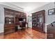 Well-appointed office featuring custom built-ins, hardwood floors, and ample storage at 5225 Mcchesney Dr, Charlotte, NC 28269