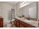 Bathroom featuring double vanity with granite countertop, tiled shower, and tile flooring at 615 Reliance Ct, Tega Cay, SC 29708